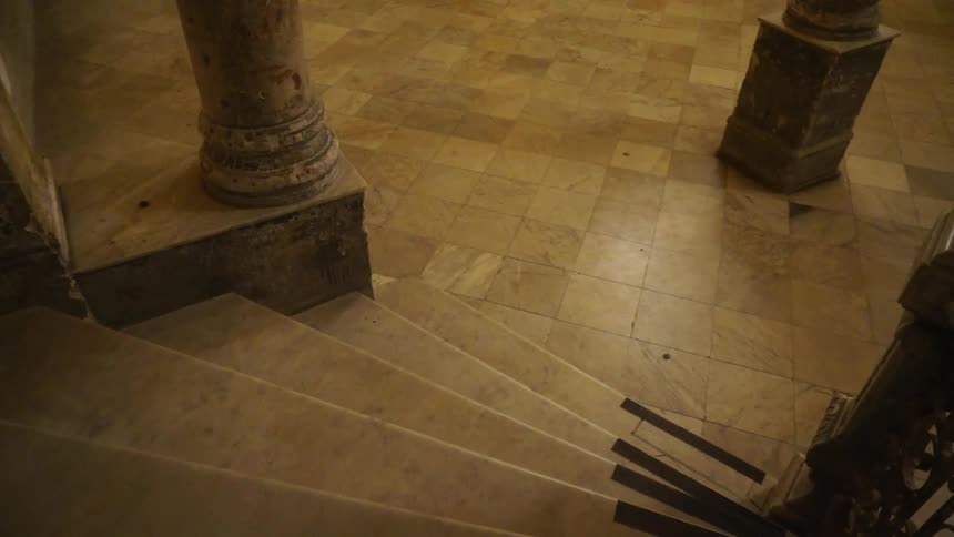 Staircase leading to a tiled floor