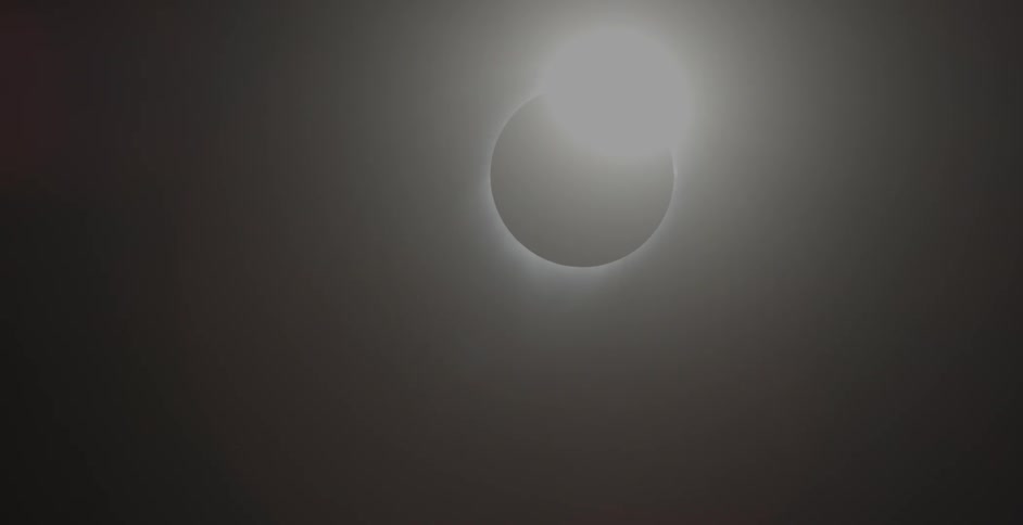 The sun emerges from shadow during a solar eclipse