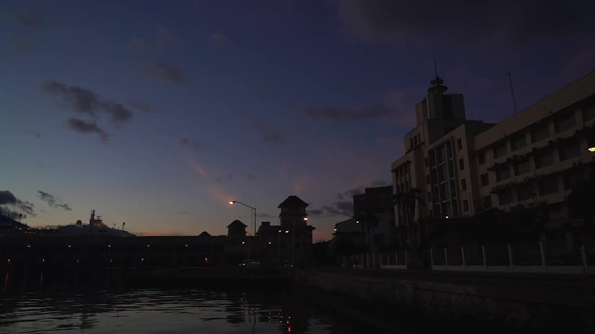 A city at sunset near a lake
