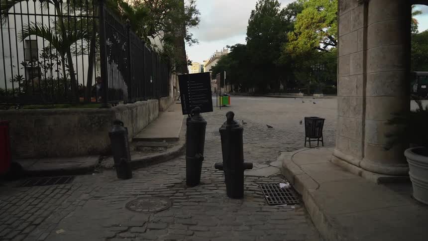 Down the alley leads to a square with birds