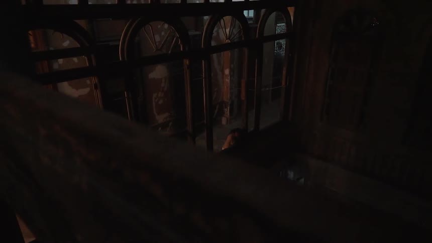The interior of a dark building is shown