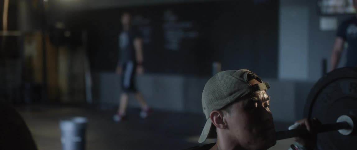 Man doing squats at the gym