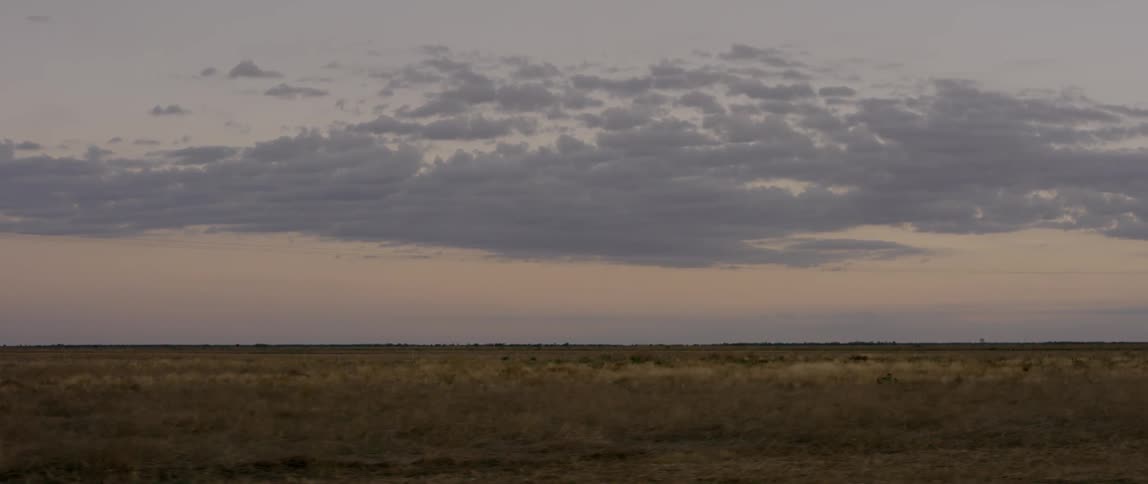 View of flat plains at sunset