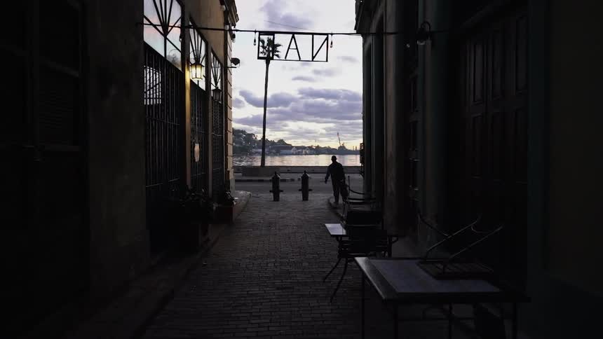 Bus passing by an alleyway