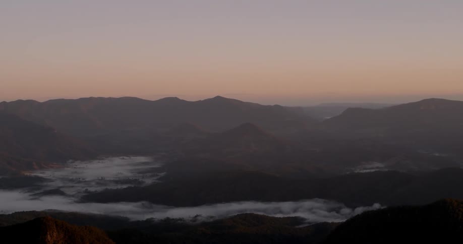 Foggy mountains at sunset
