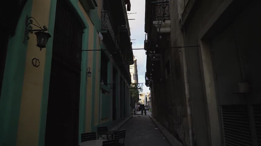 The long dark alley has many shops on either side