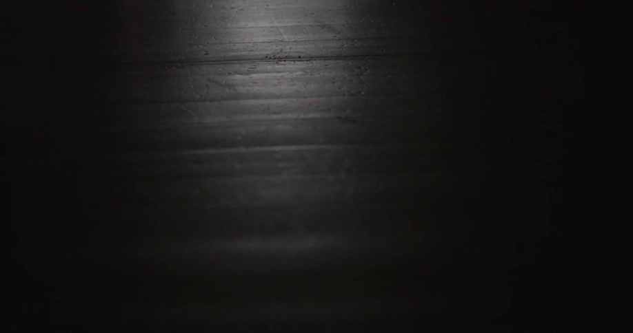 The table is dark with only partial lighting