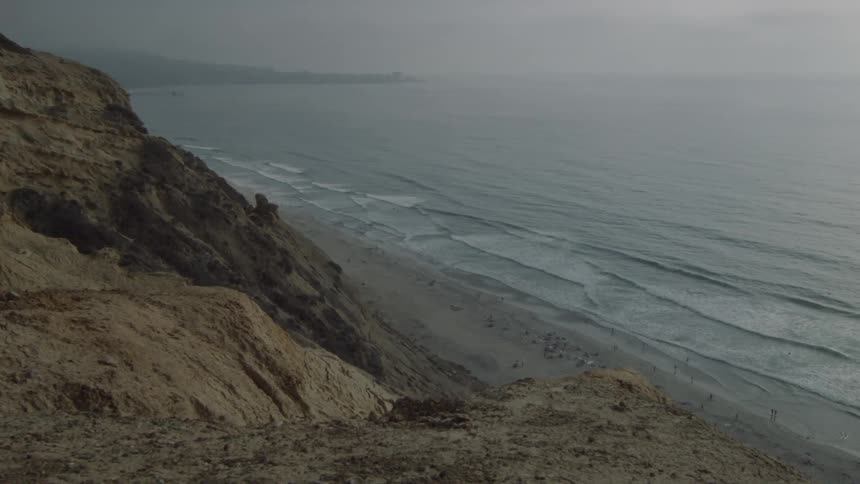 View of a shore with high cliffs around it