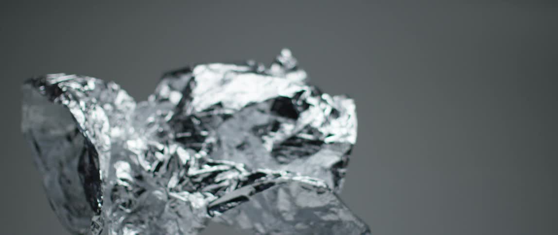 Crinkled tin foil drops from the air