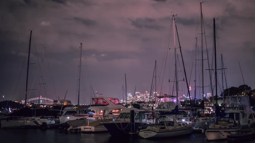Time lapse of boats floating on a harbor