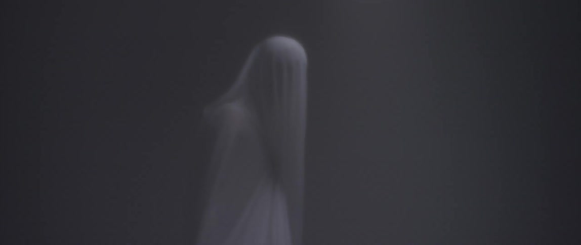 A person covered in a sheet