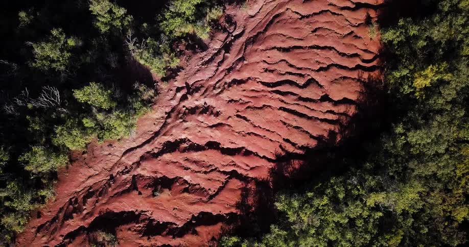 Red rock covers the ground in the wilderness