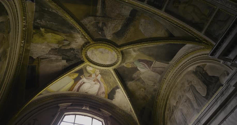 A painted dome ceiling over arched windows