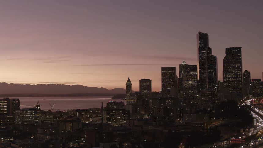 Pullback reveal of the Seattle skyline at sunset