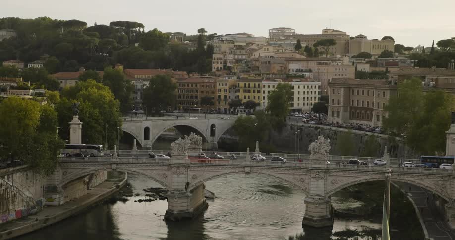 Cars drive across a city bridge