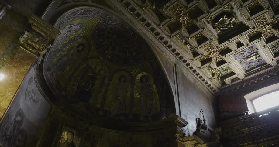 The hall is dark and full of artwork