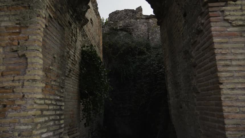 The archway is dark on a cloudy day