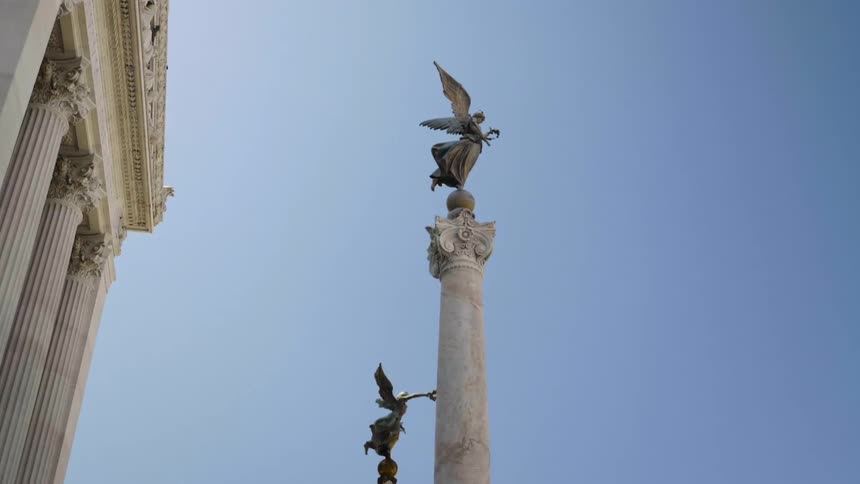 Angels on top of tall pillars