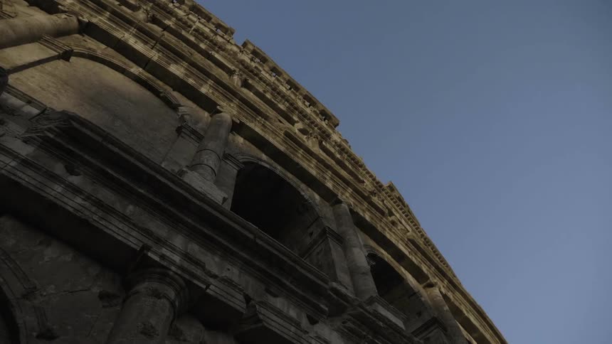 The side of an old building stands overhead