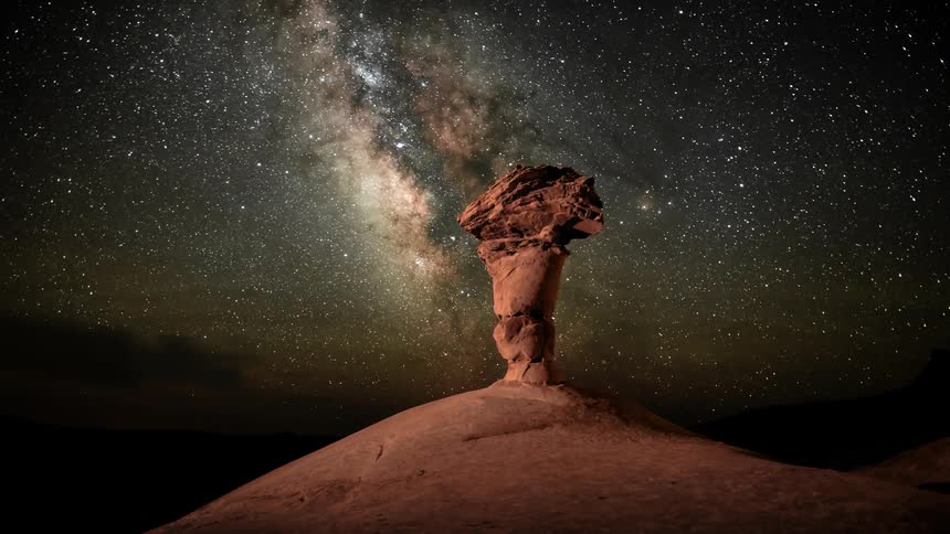 Clouds and stars passing over the desert