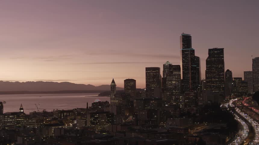 Seattle cityscape at sunset with Olympic Mountain background