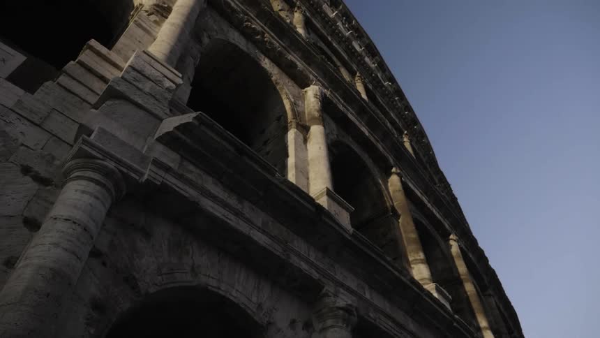 A stone building has many archways on every floor