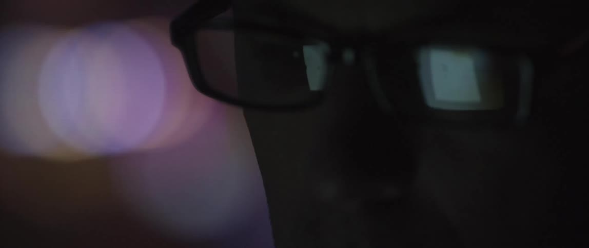 Close up of the reflection in a man's glasses