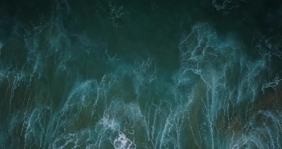 Ocean waves curl and break