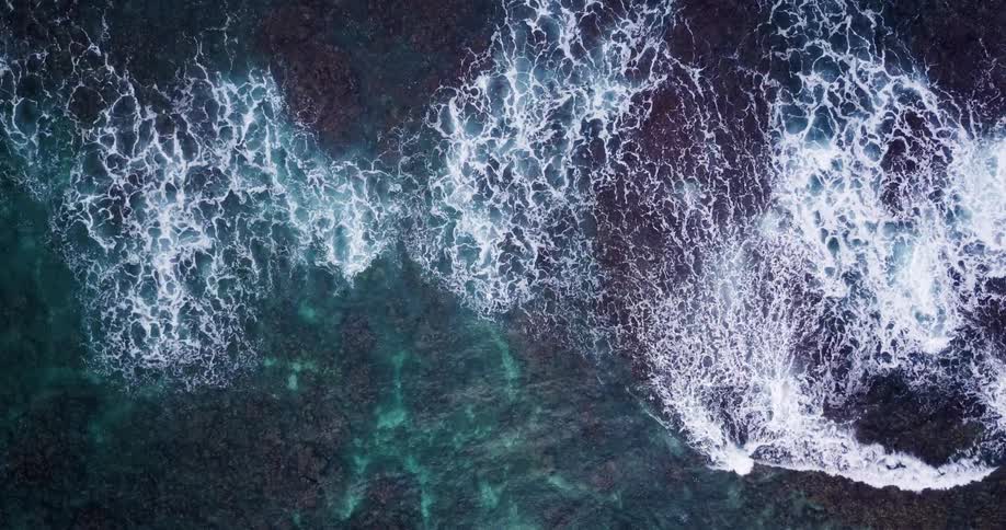 Waves roll in a body of water