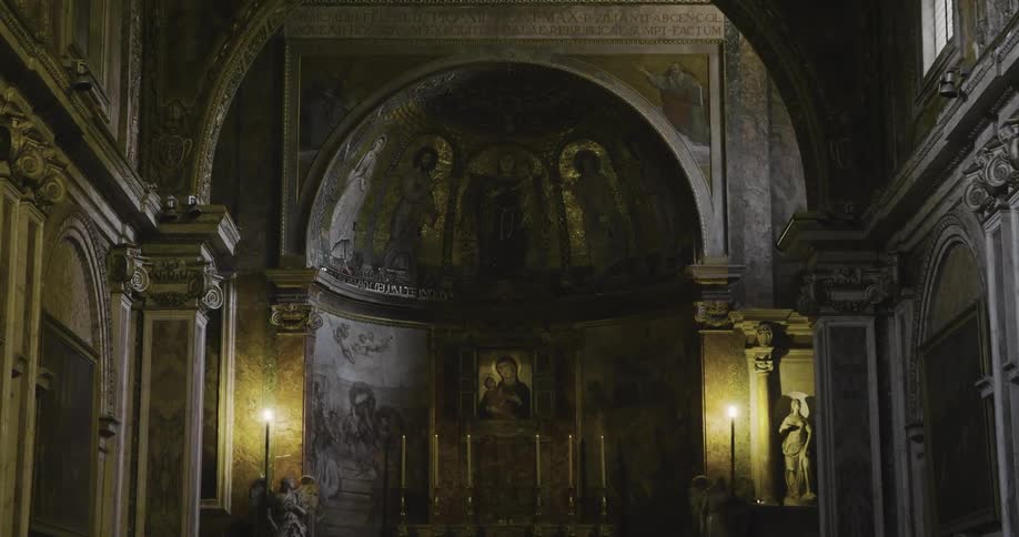 Paintings cover the walls and ceiling in a cathedral