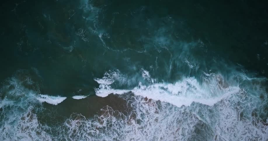 Ocean waves flow towards the beach