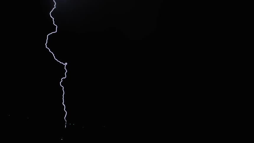 Lightning snakes down from the sky at night