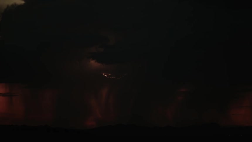 Lightning flashes in the dark night sky