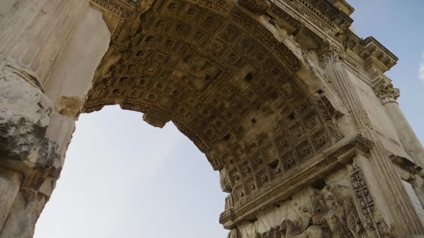 An old stone archway towers overhead