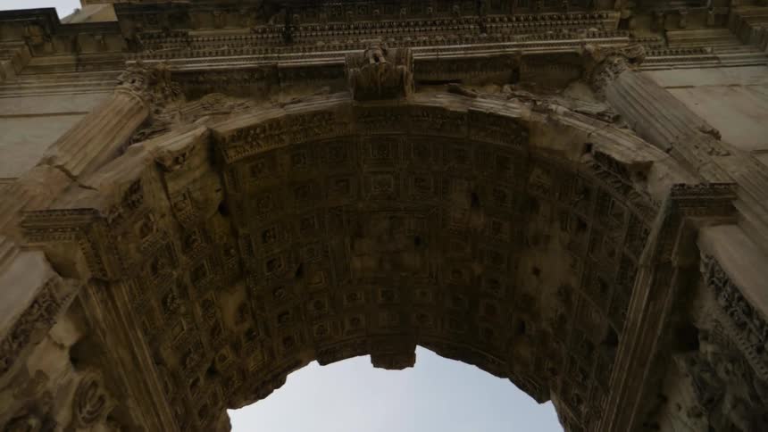 View looking up at a stone archway