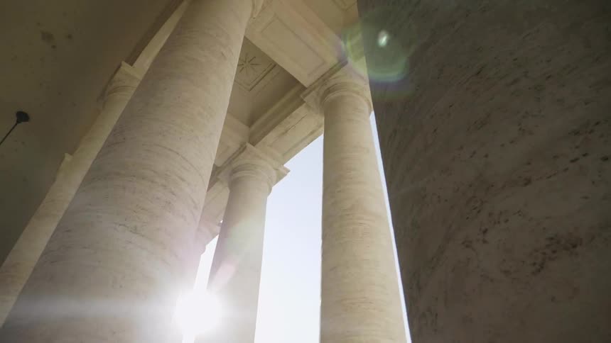 The tall pillars are near the entrance of the hall