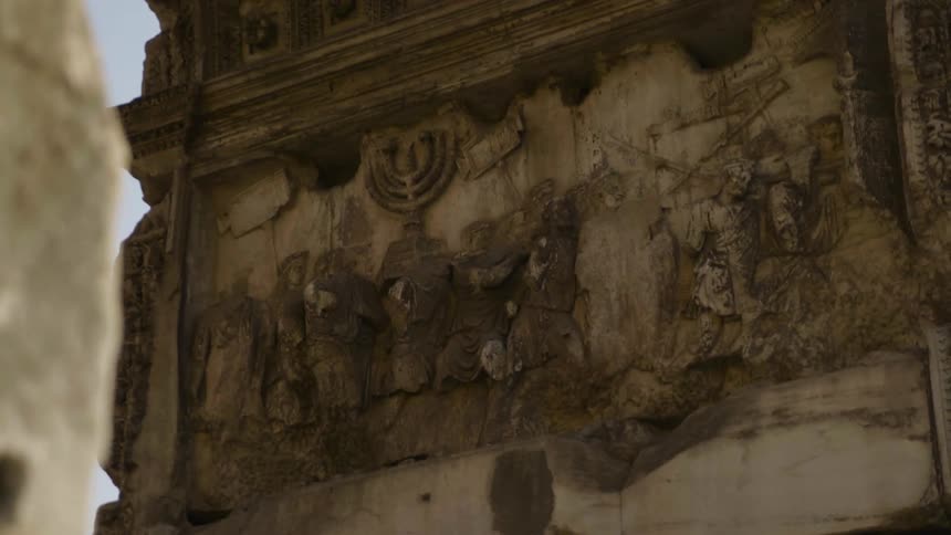 Carvings cover a stone wall