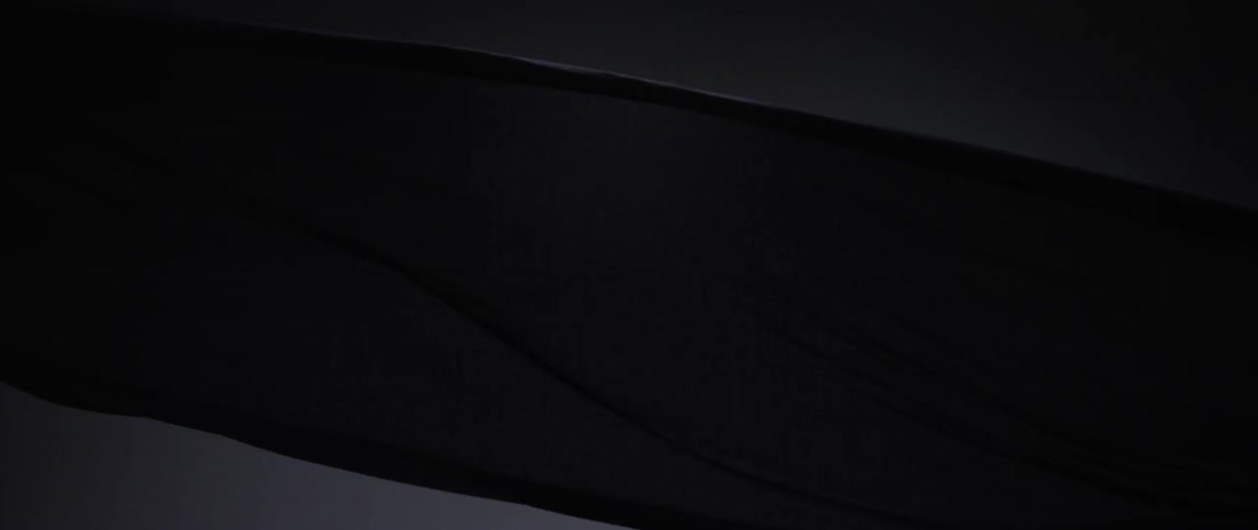 Cloth flowing in wind in a dark area
