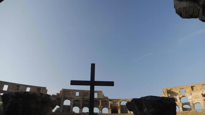 A cross is in the middle of a clear sky