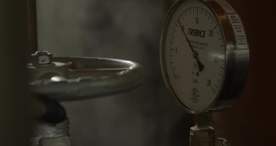 A lever is being turned slowly