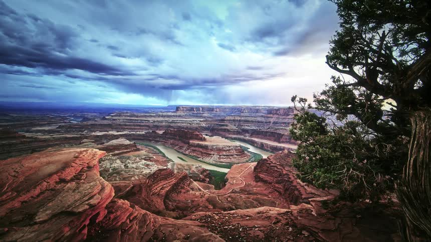 Clouds move fast over the canyon below