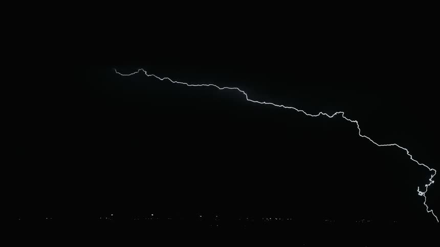 Lightning flashes in the dark night sky