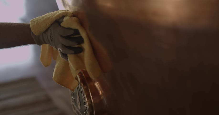 A man is polishing a still