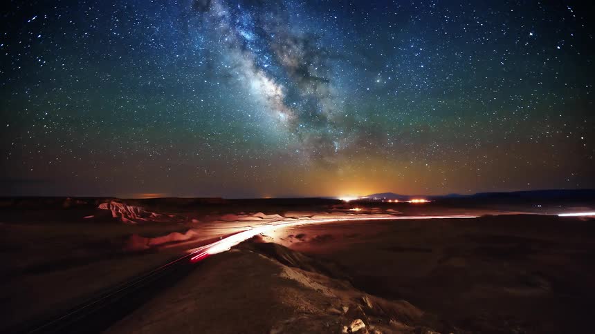A busy street under a starry sky