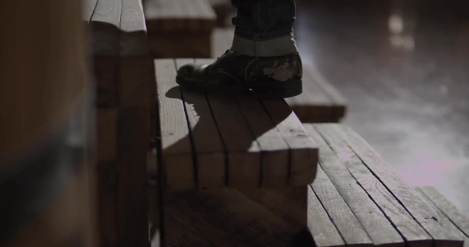 Person walking up small wooden stairs