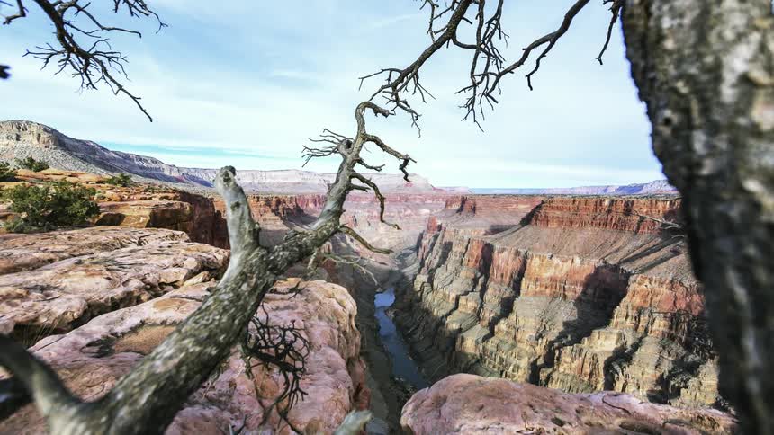 The canyon has a river in the center
