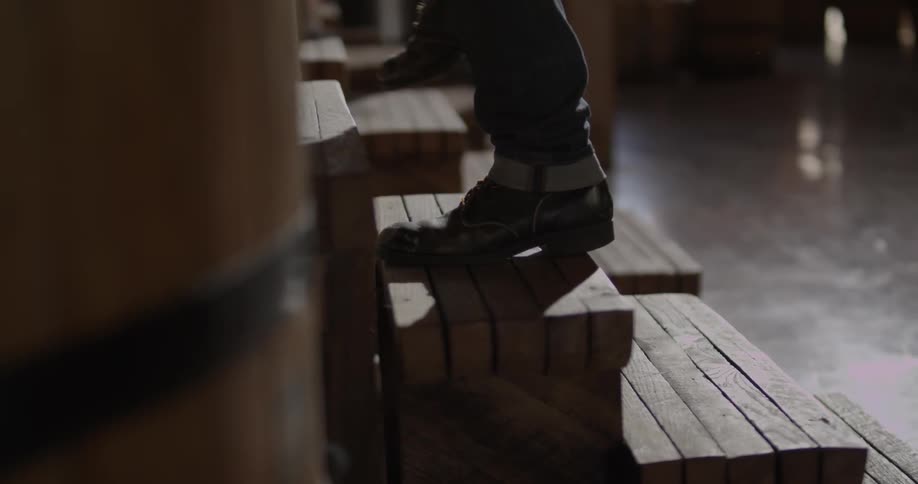 A person walks up the wood steps