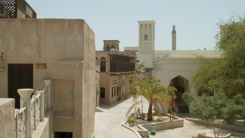 Buildings are shown in a city on a sunny day