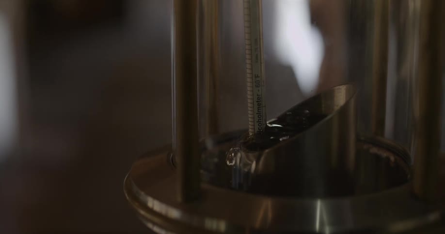 A thermometer inside of liquid