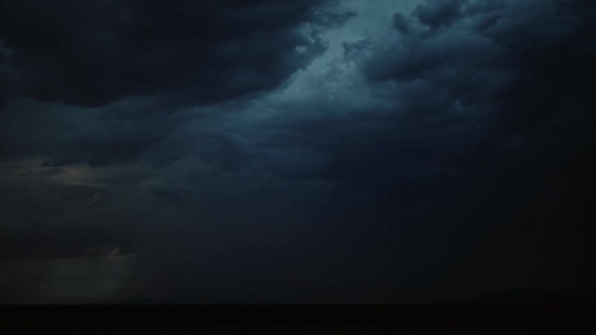 Lightning flashes in the dark night sky
